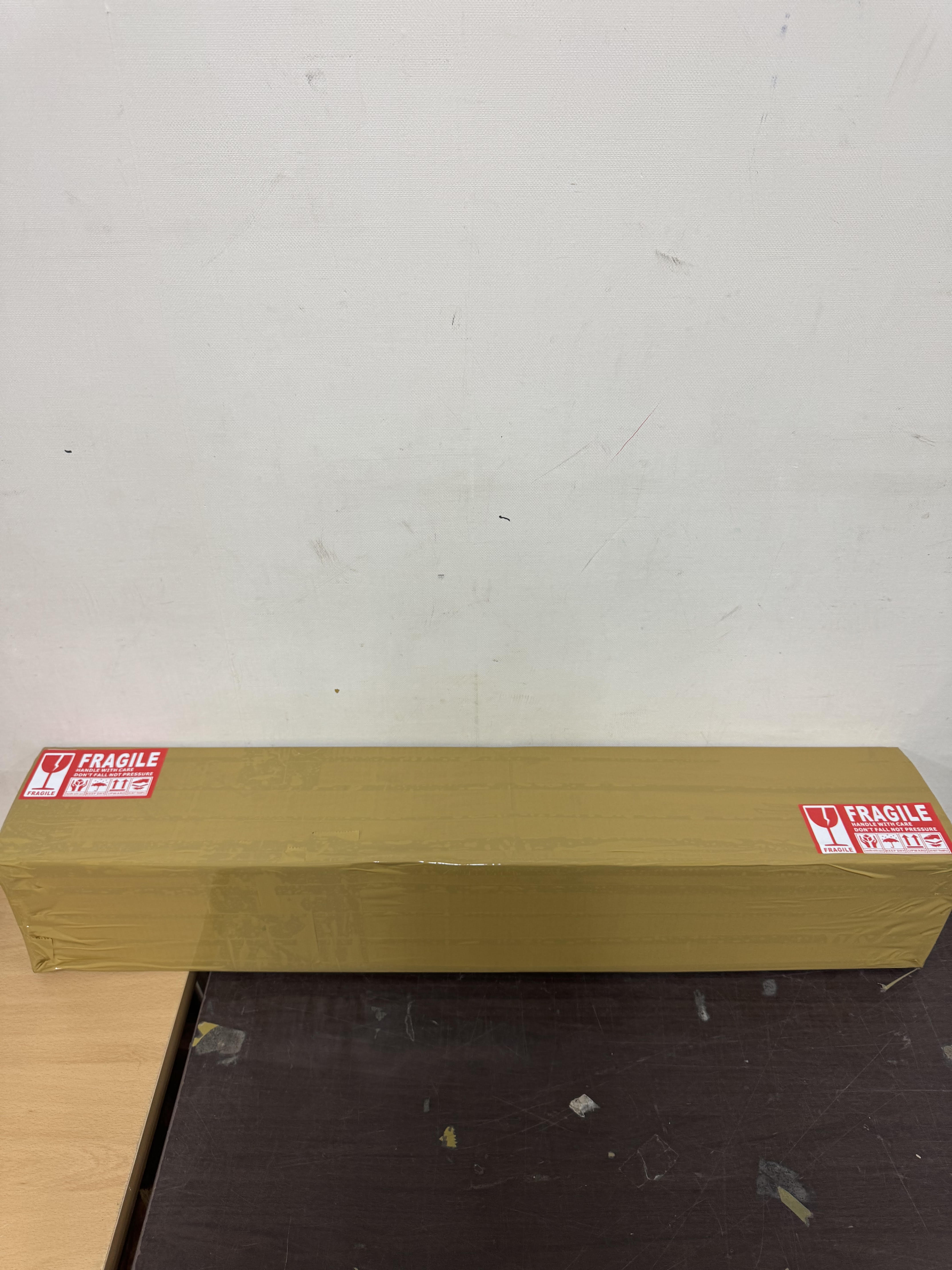Sealed shipping box with FRAGILE stickers