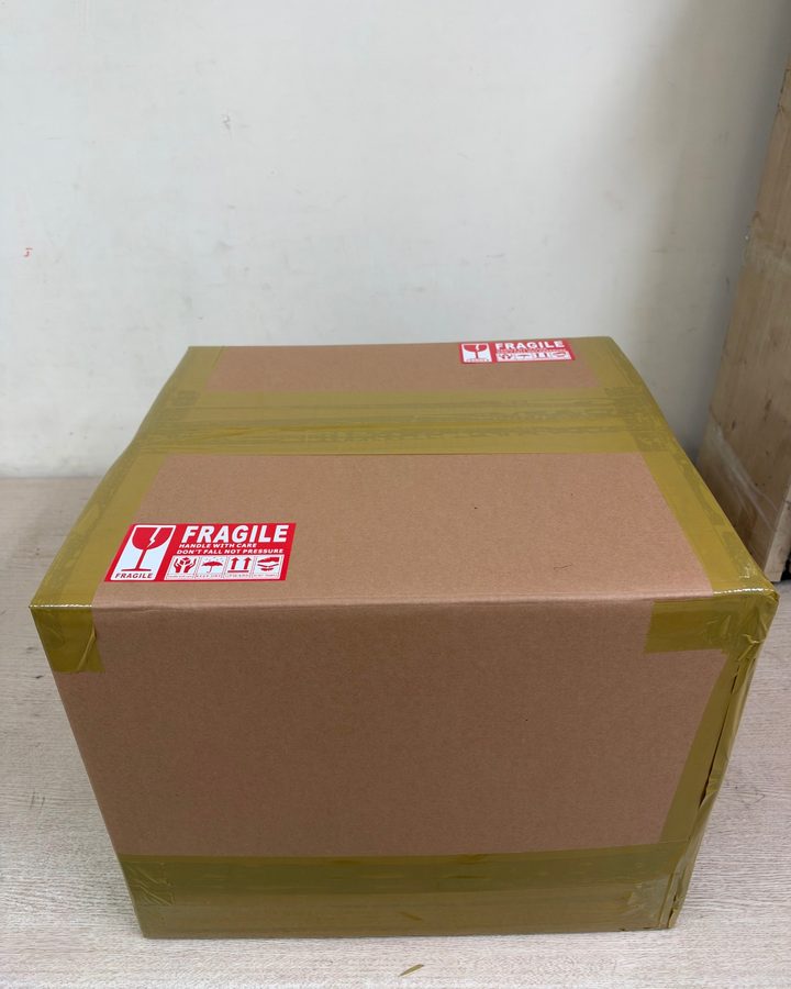 The finished box, taped on every seam with FRAGILE labels